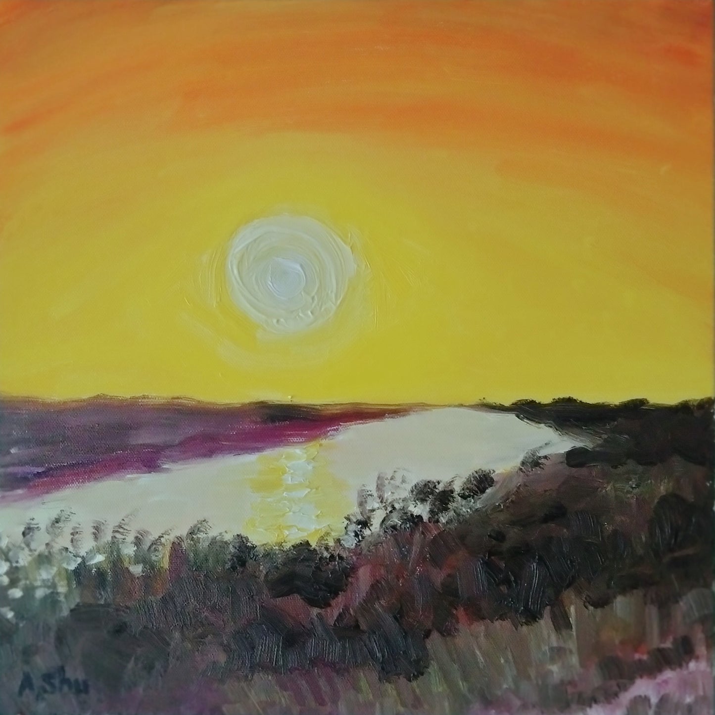 Sunset with bright orange and yellow sky reflecting in the Everglades waters in Florida