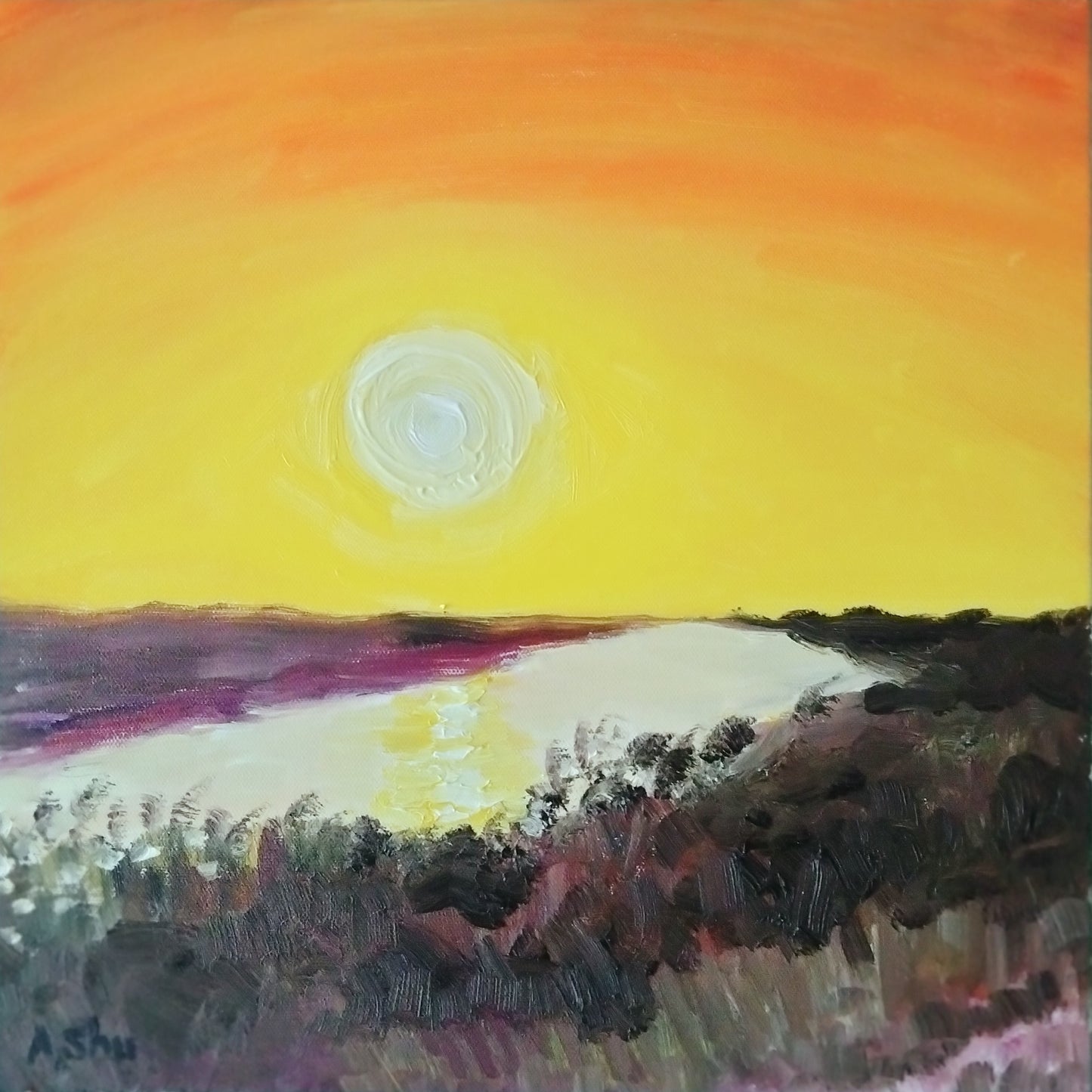 Sunset with bright orange and yellow sky reflecting in the Everglades waters in Florida
