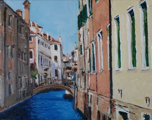 Painting of a small and quiet canal dividing colorful stone building facades on a bright afternoon in Venice