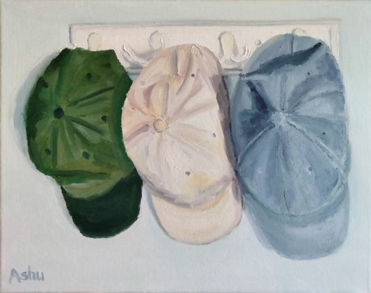 Painting of three worn-out baseball hats hanging on a wall hook