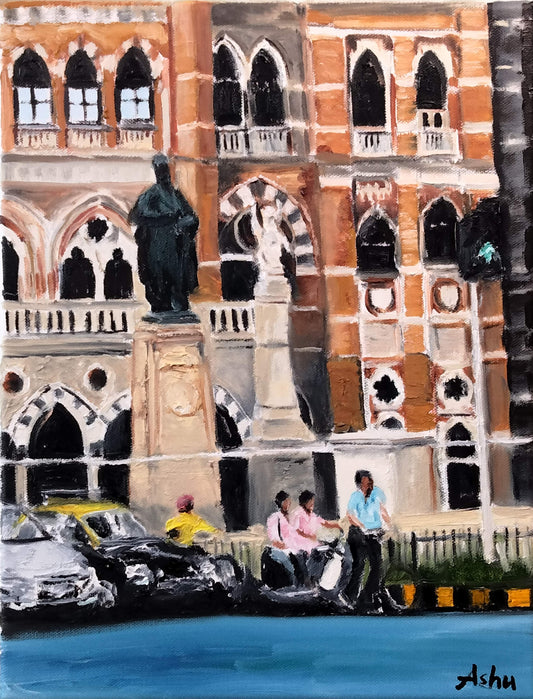 The city of Mumbai scene with a building facade of Indo-Gothic architecture, statues and street traffic of two- and four-wheelers