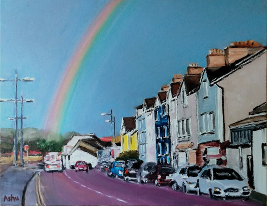Painting of a magnificent rainbow popped up at the horizon, seen from the car driving down a one-lane highway in Cork City, Ireland