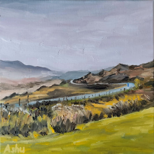 Painting of narrow road winding through the hills and mountains seen from a distance under the morning skies in Ireland