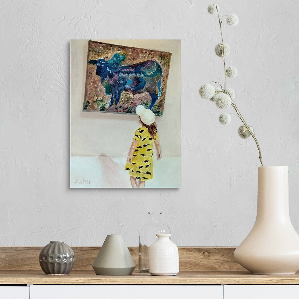 Framed artwork of a woman in a yellow dress with a blue abstract figure, displayed on a wall above a wooden shelf with decorative vases.