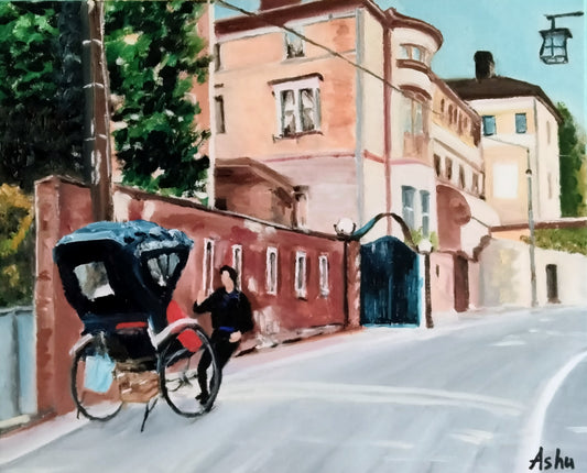 Man in warm black outfit, pulling a rickshaw, walking backwards and chatting with a passenger on an uphill street in Kyoto, Japan, on a mildly sunny, cool winter day. A large mansion with a walled compound with an iron gate seen in the background